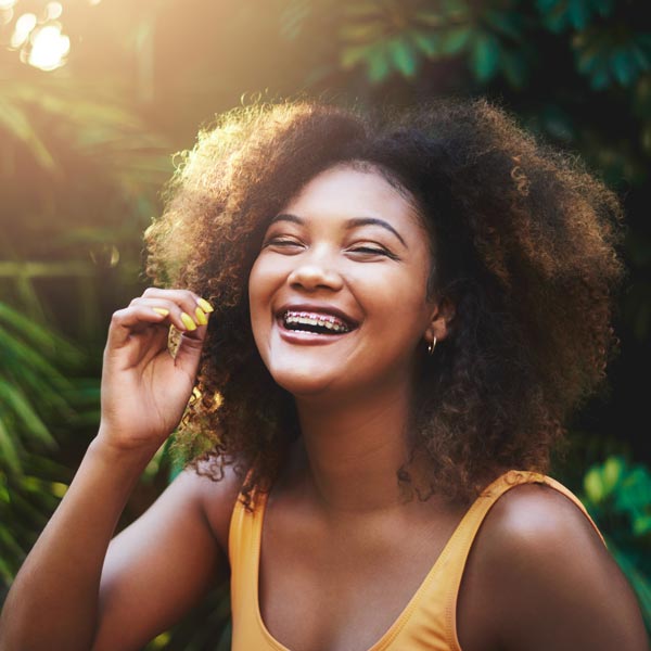 smiling young woman with braces